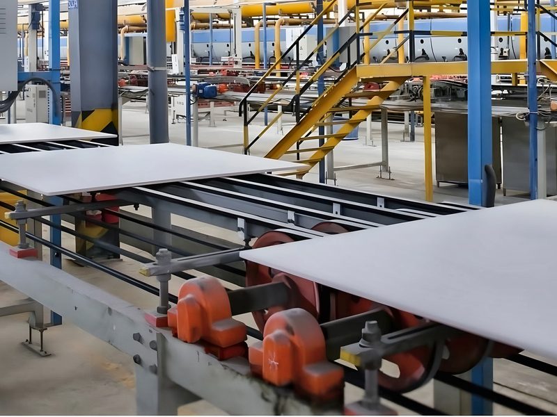 Finished white tiles on a roller conveyor in a tile factory