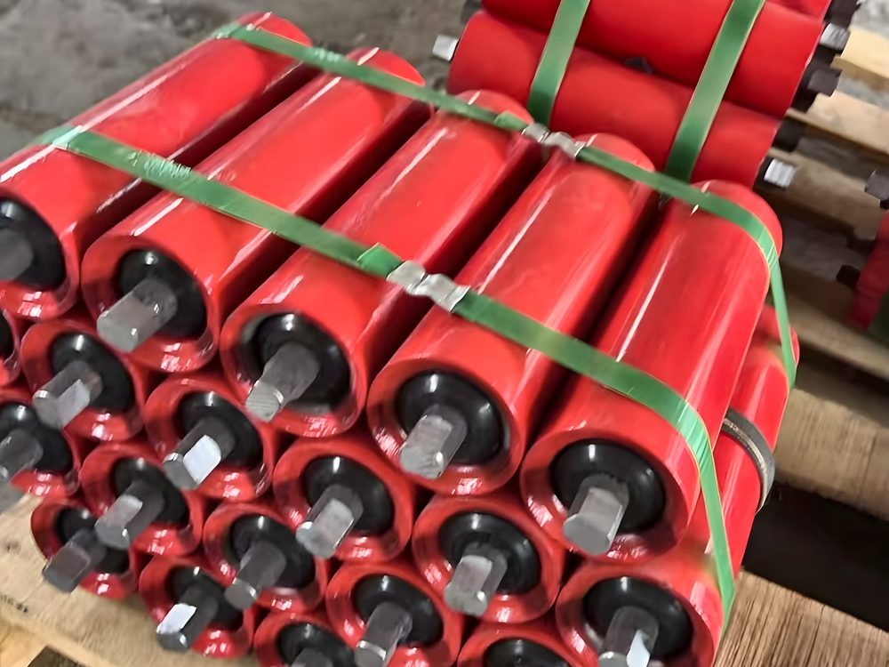Red conveyor rollers strapped on a pallet