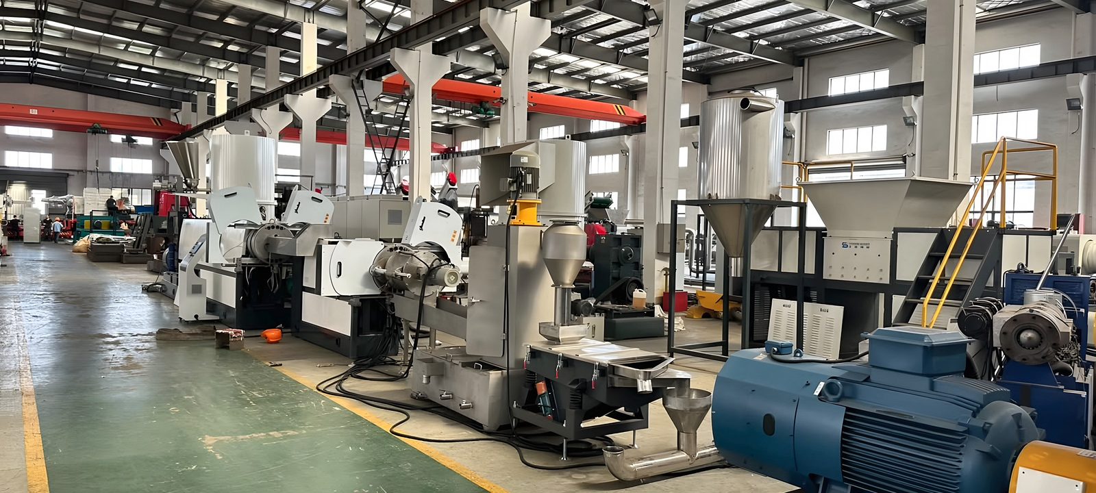 Plastic extrusion and recycling lines in a factory hall